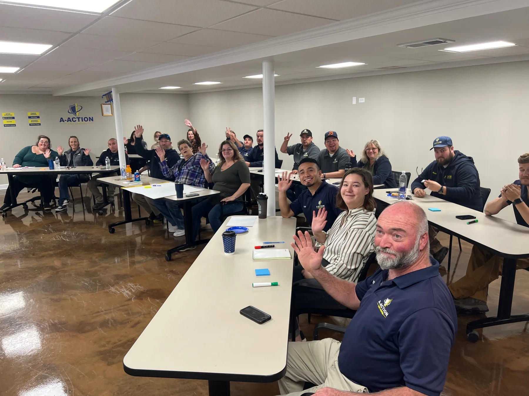 A-Action Pest Control employees participate in a seated culture workshop.