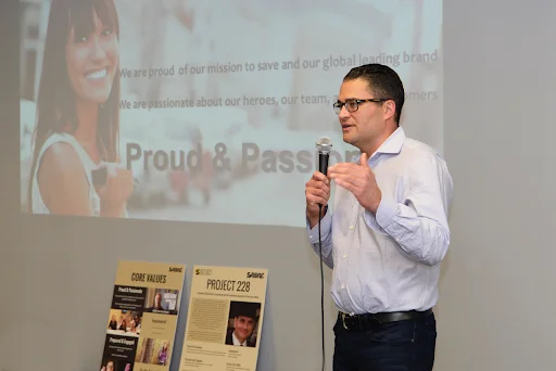 A SABRE speaker presents the Proud & Passionate core value.
