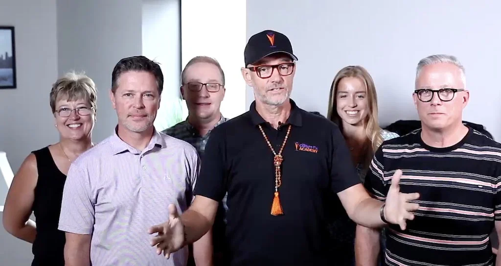 Will Scott stands with a group of colleagues.