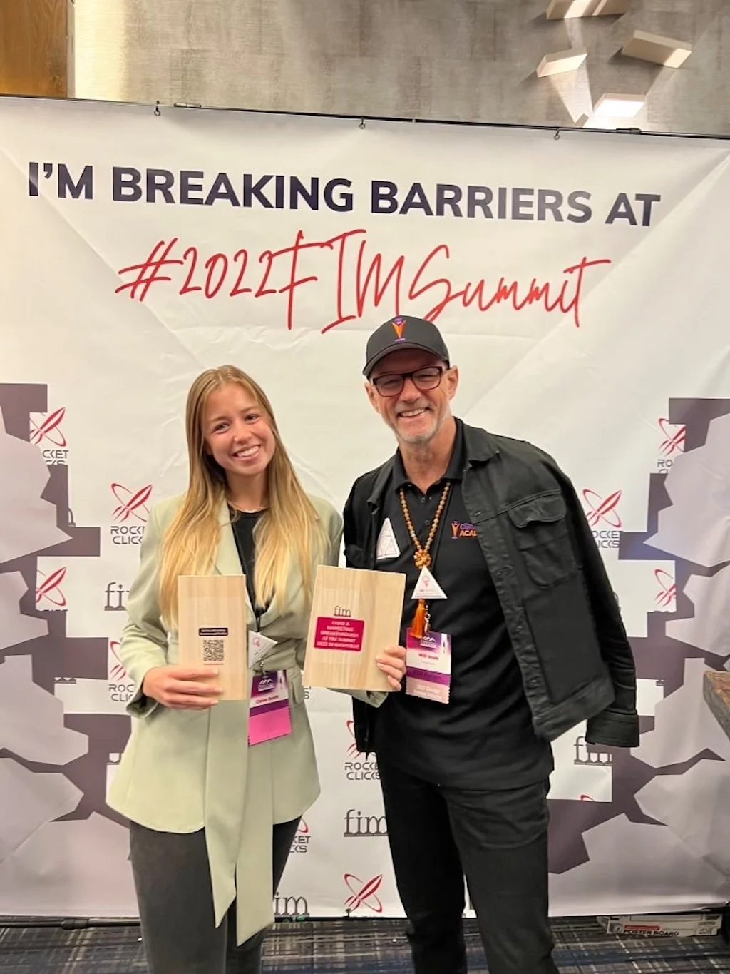 Will Scott and an attendee pose at the 2024 IM Summit.