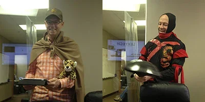 Two team members dress as illustrated core value characters.